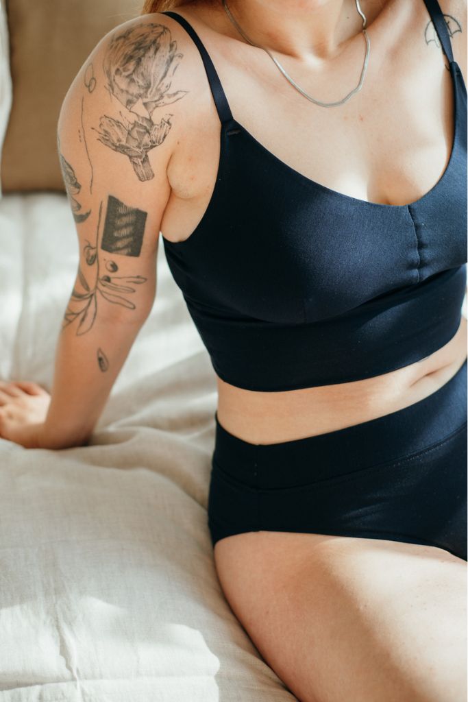 the woman wears the Emma Bralette and the Emma slip made of Tencel Lyocell